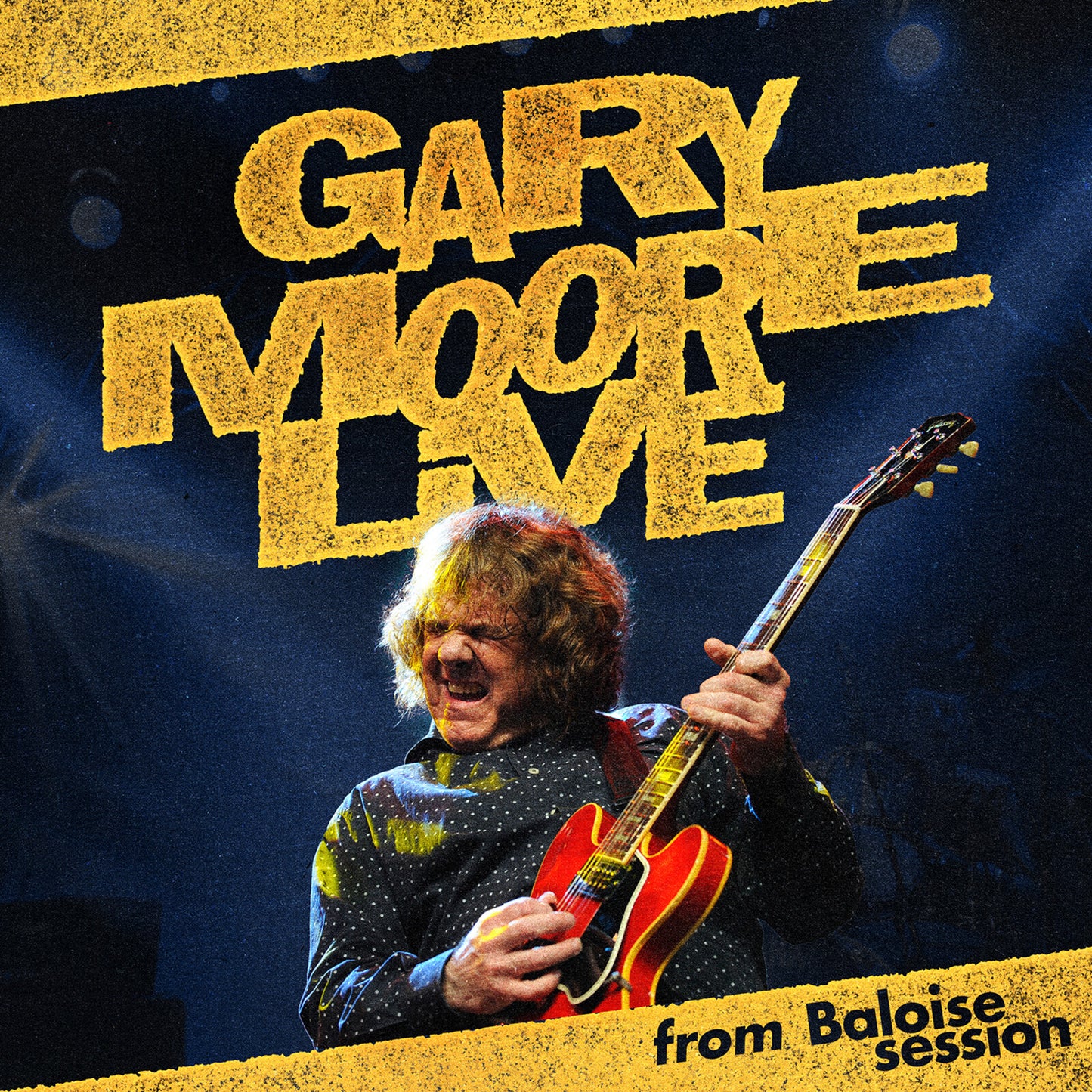 Gary Moore playing a red electric guitar on a dark stage with yellow text.
