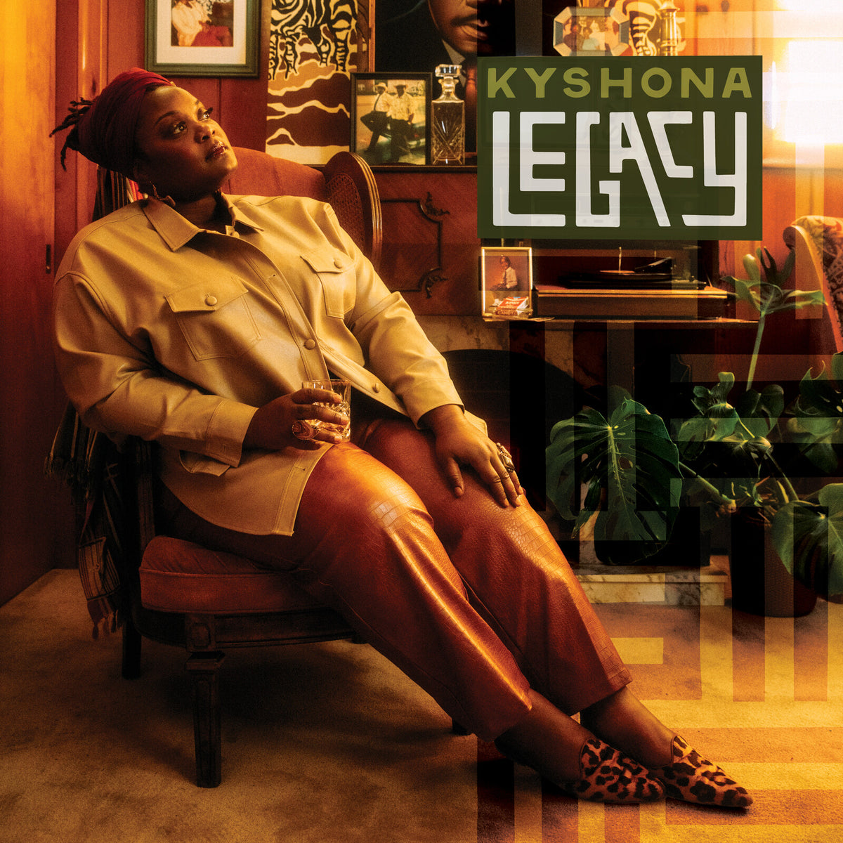 Album cover for Kyshona’s “Legacy” featuring a woman in a chair.