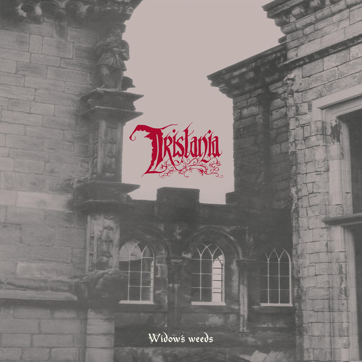 Gothic architecture framing the band name “Tristania” and album title.