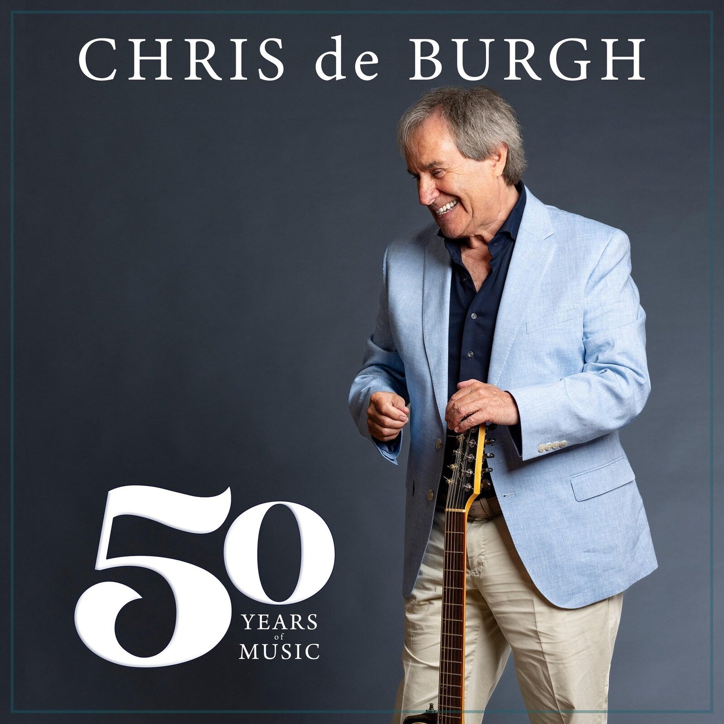 Chris de Burgh with guitar, album cover celebrating 50 years of music.