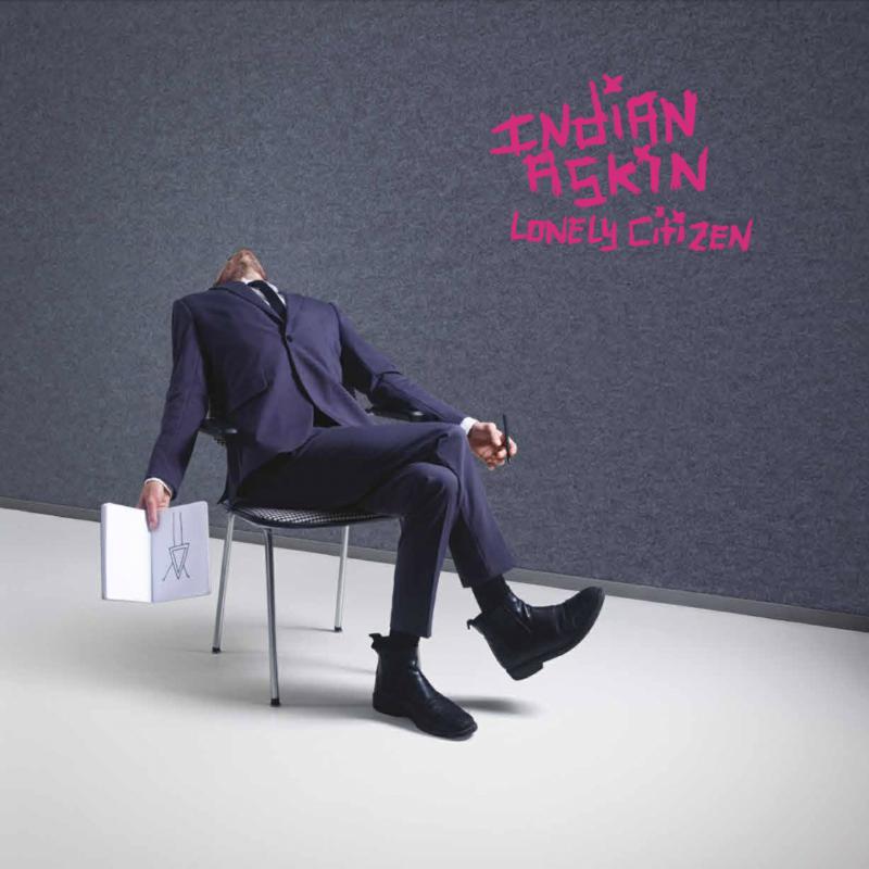 Album cover: suited figure slumps in a chair, pink text reads "Indian Askin".
