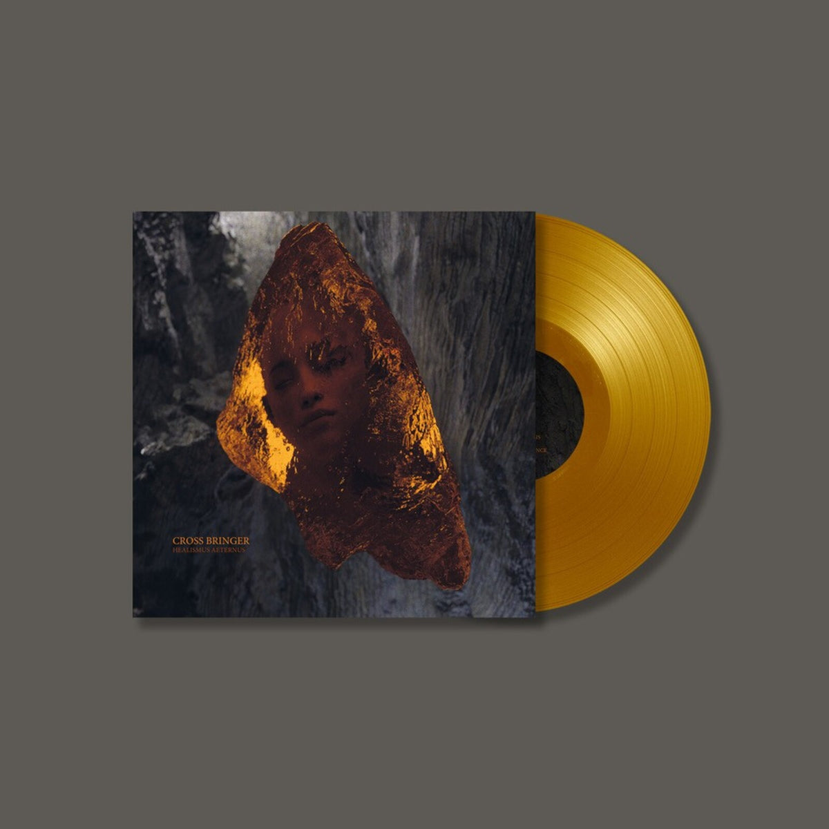 Vinyl record and album cover featuring a face within a crystal formation.