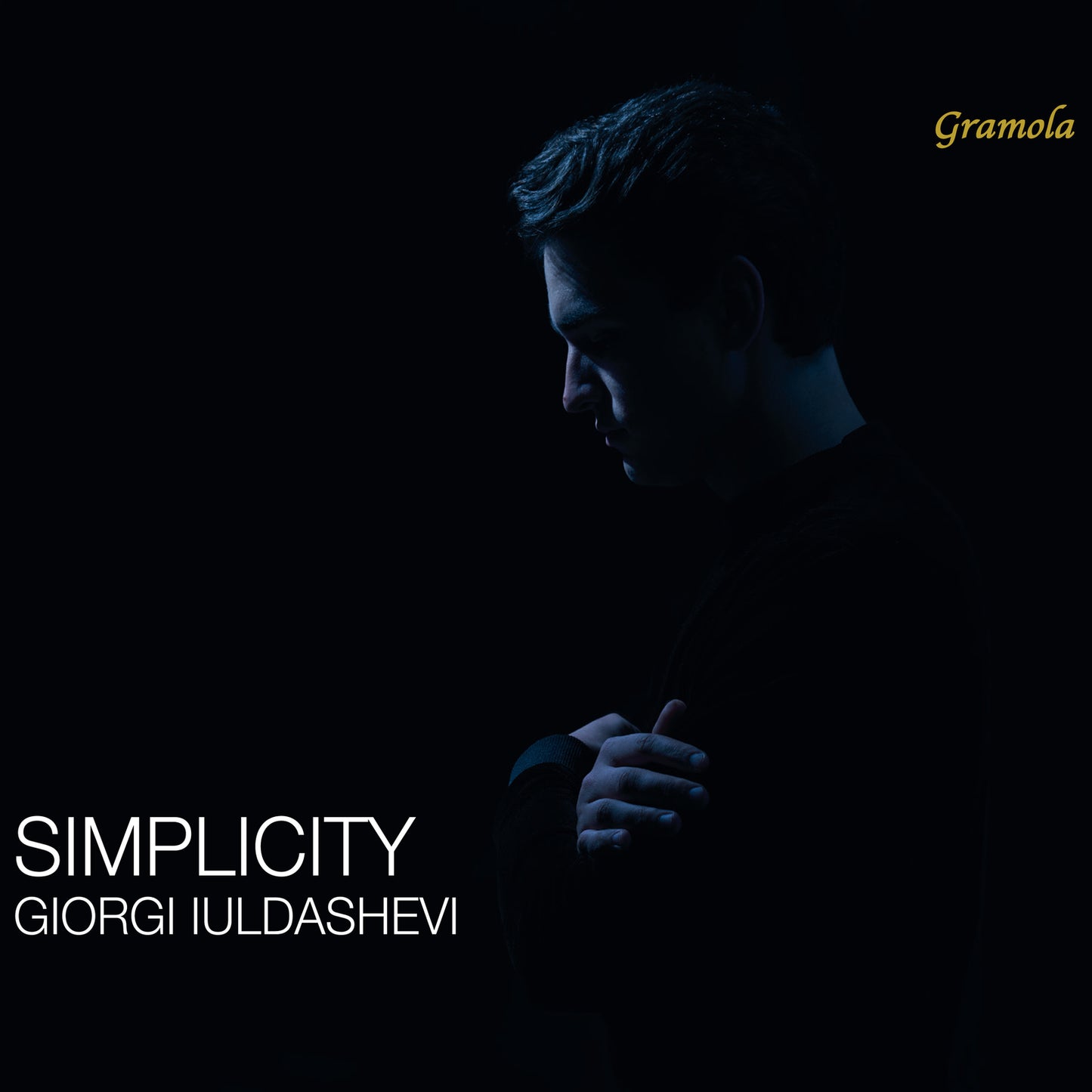 CD cover featuring a portrait of Giorgi Iuldashevi in shadow.