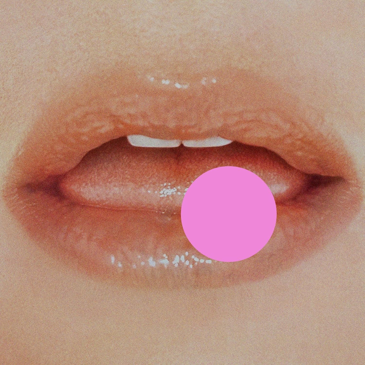 Close-up of lips with a pink circle inside the mouth.