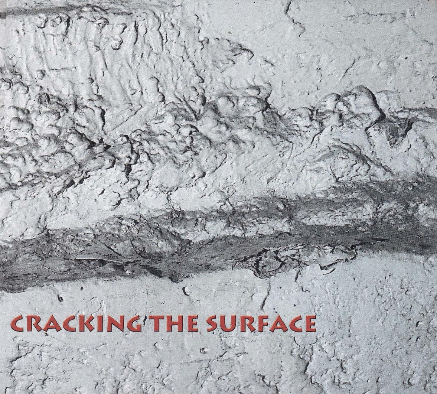 CD cover with textured, cracked white surface and red title text.