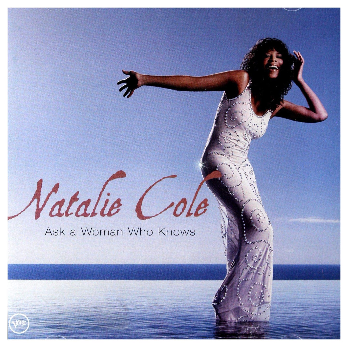 Natalie Cole album cover, featuring her in a sparkling gown by the sea.