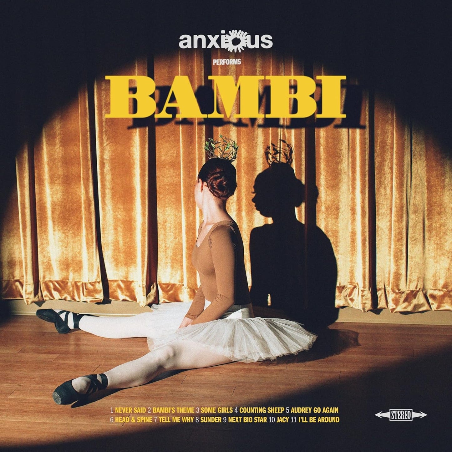 Yellow vinyl record cover featuring a dancer in a tutu before a curtain.