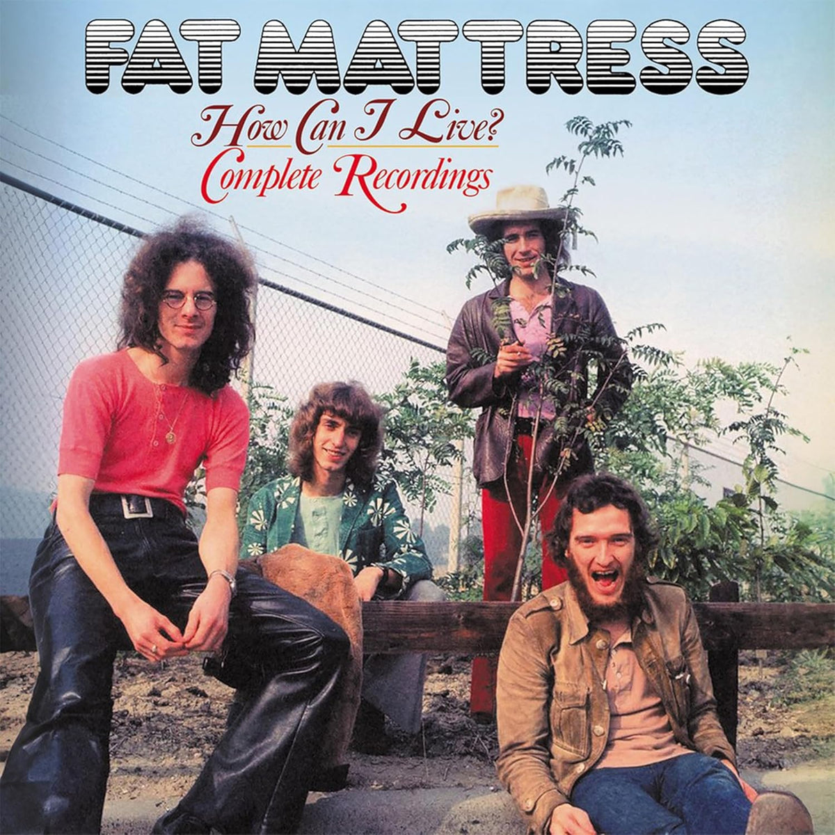 Album cover featuring four men in 1970s attire standing in front of foliage.