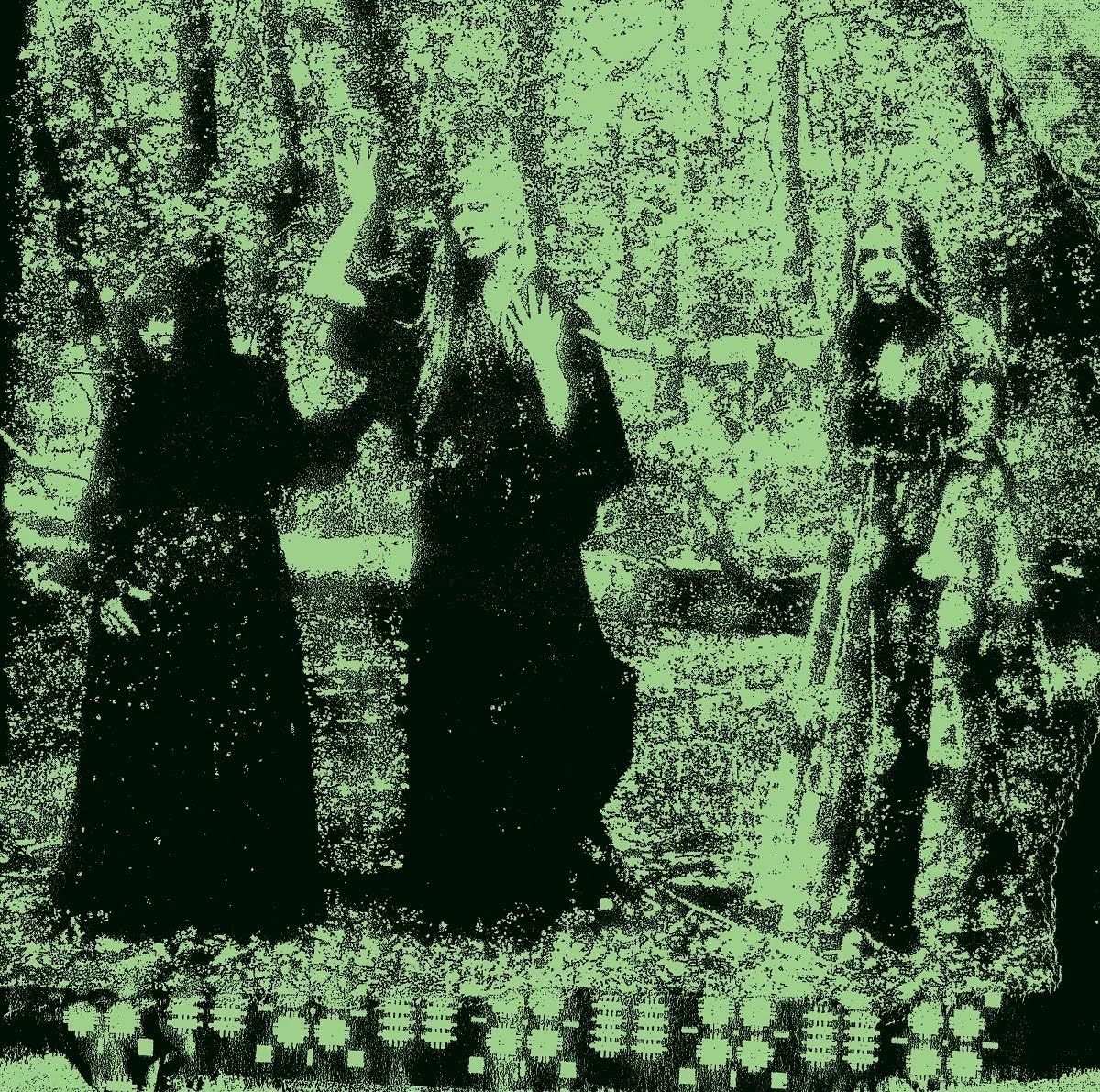 Green-toned, grainy image of four figures in dark clothing.
