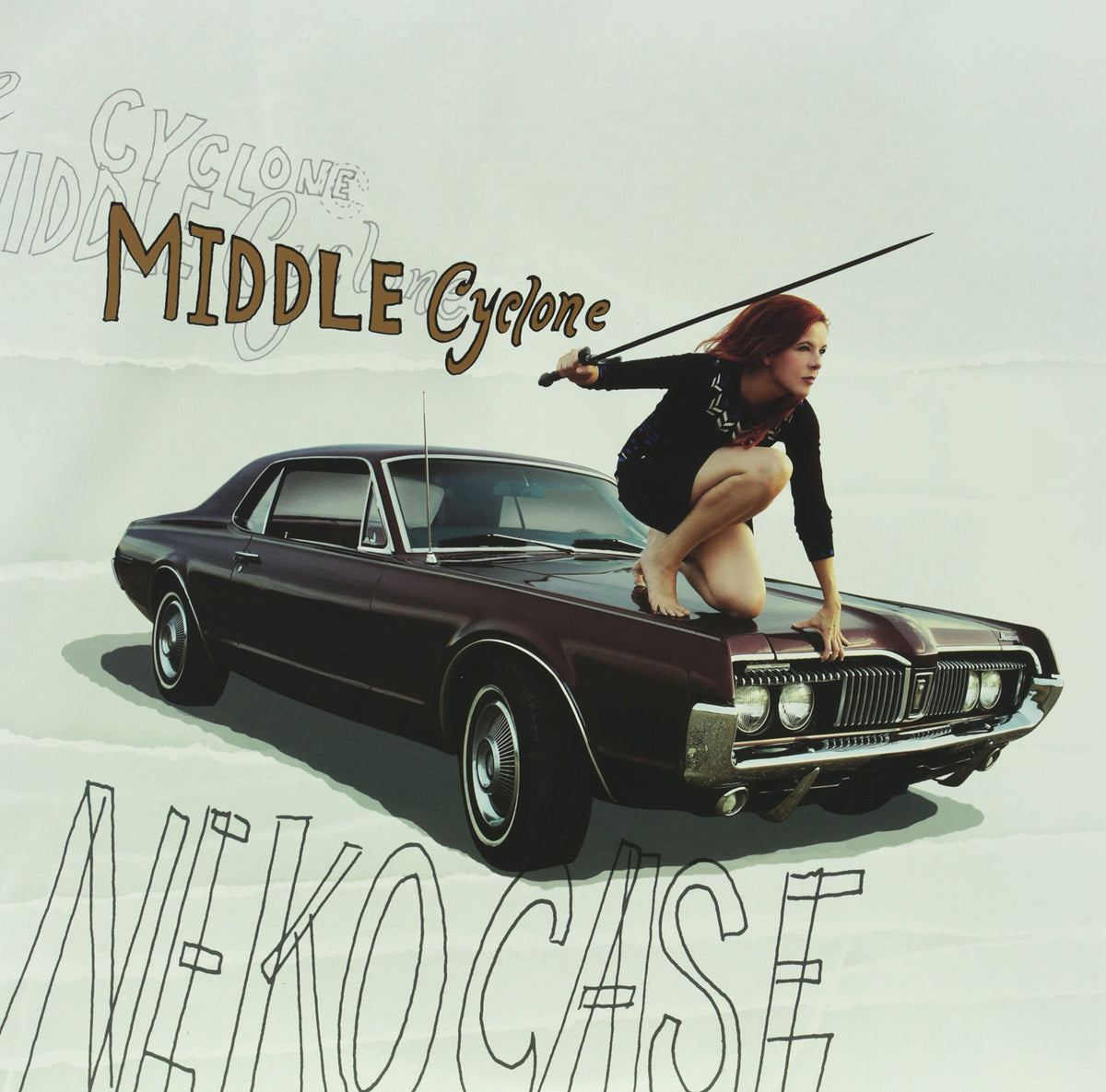 Neko Case album cover: woman on a maroon classic car.