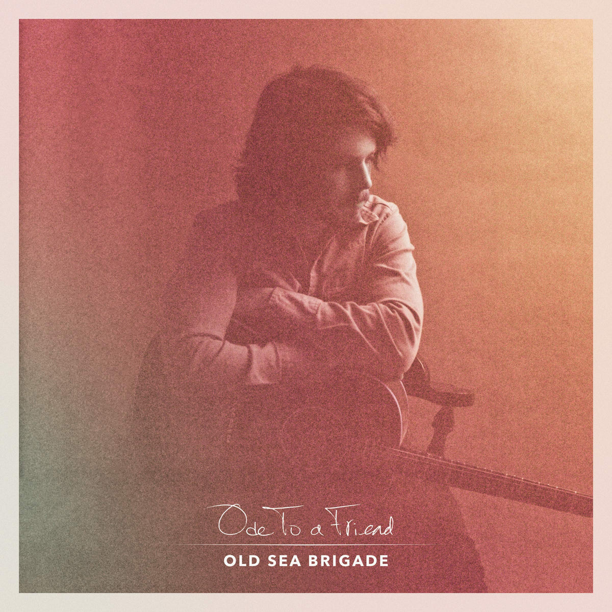 Vinyl album cover featuring a portrait of a man with a guitar.