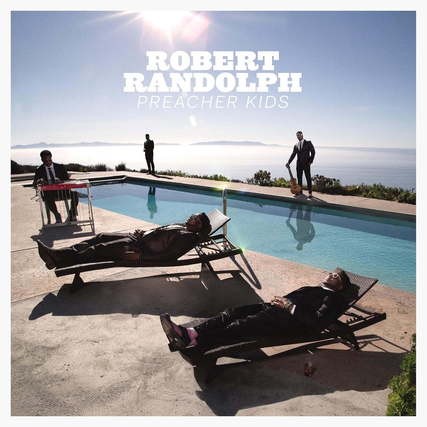 Robert Randolph album cover: musicians by a pool with ocean view.