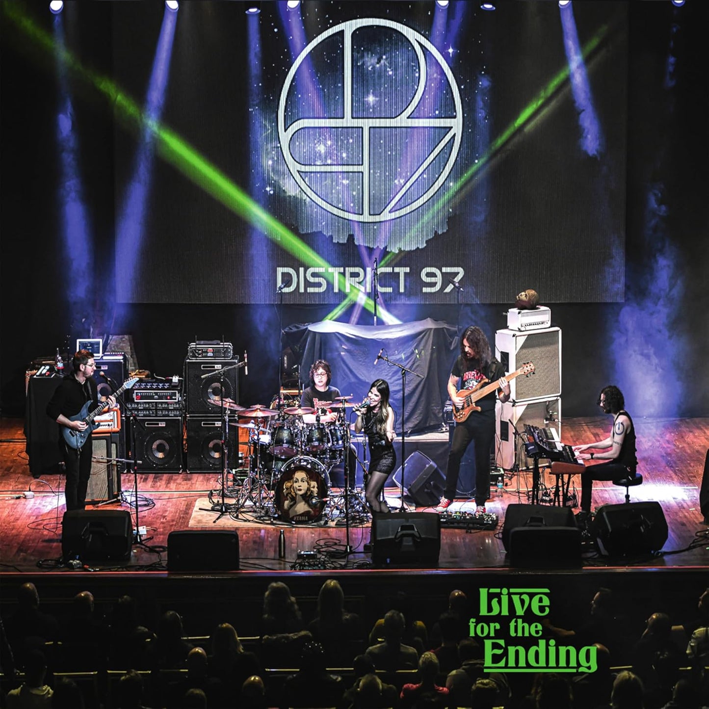 District 97 band performing live on stage with stage lighting.