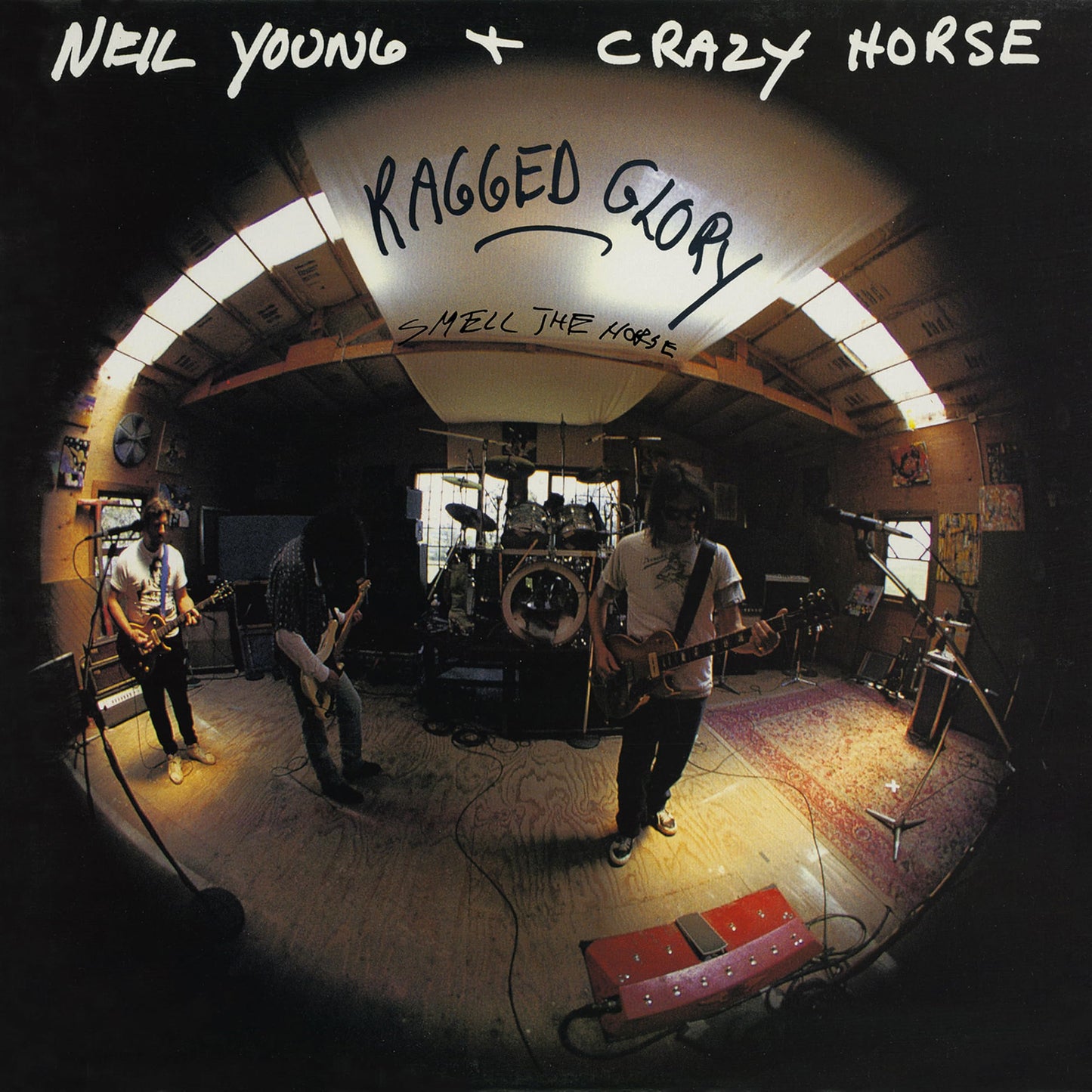 Neil Young & Crazy Horse album cover, band playing in a cluttered room.