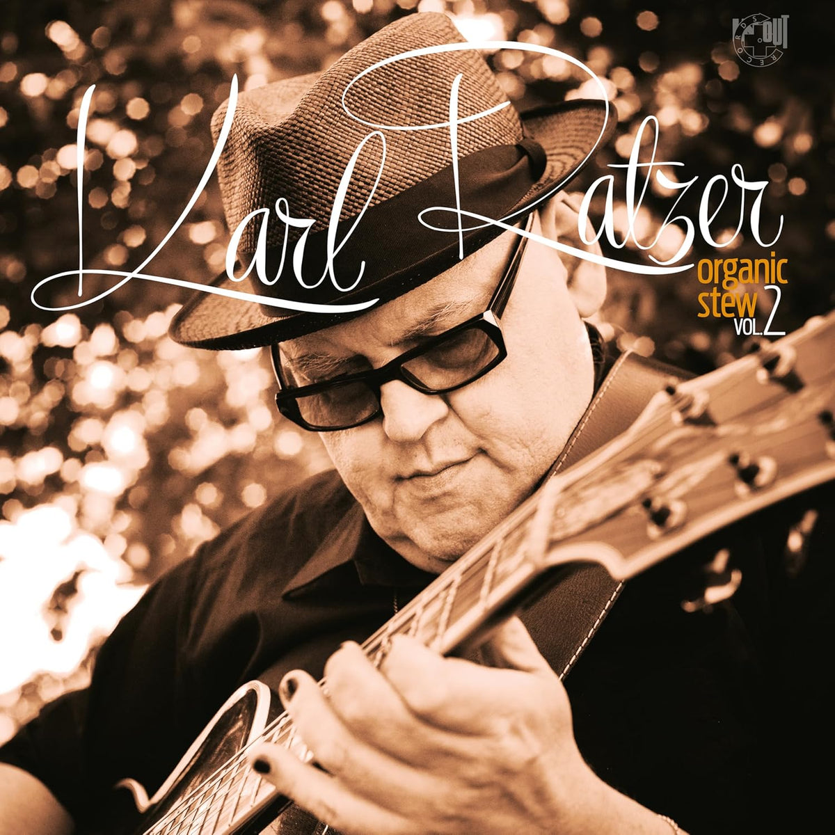 Karl Ratzer album cover featuring a man playing guitar, "Organic Stew Vol. 2".