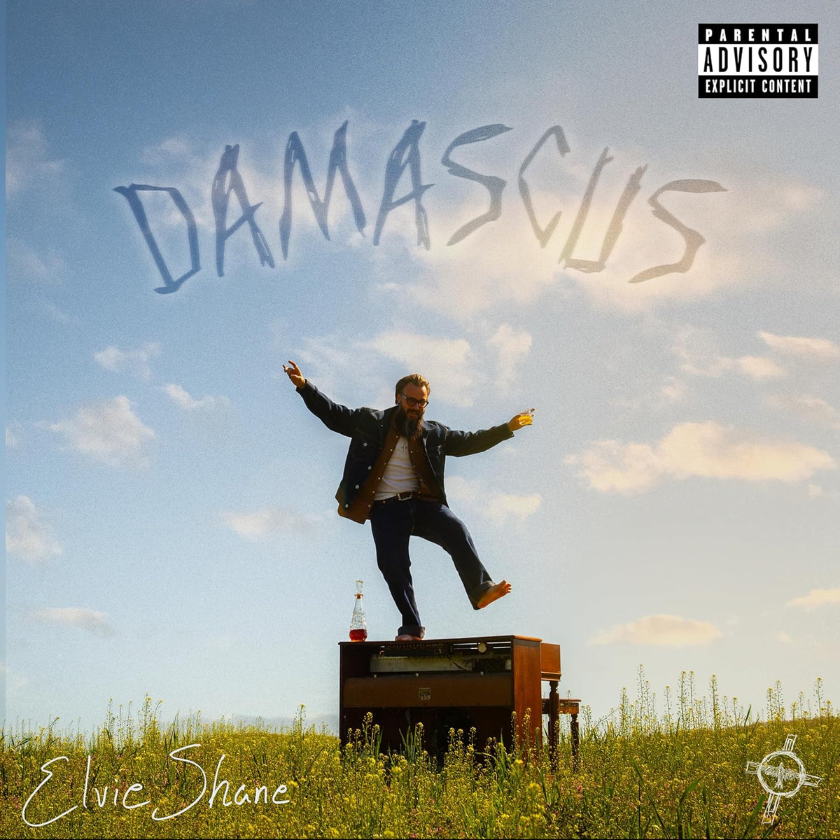 CD cover for Shane & Elvie’s “Damascus” featuring a man in a field.