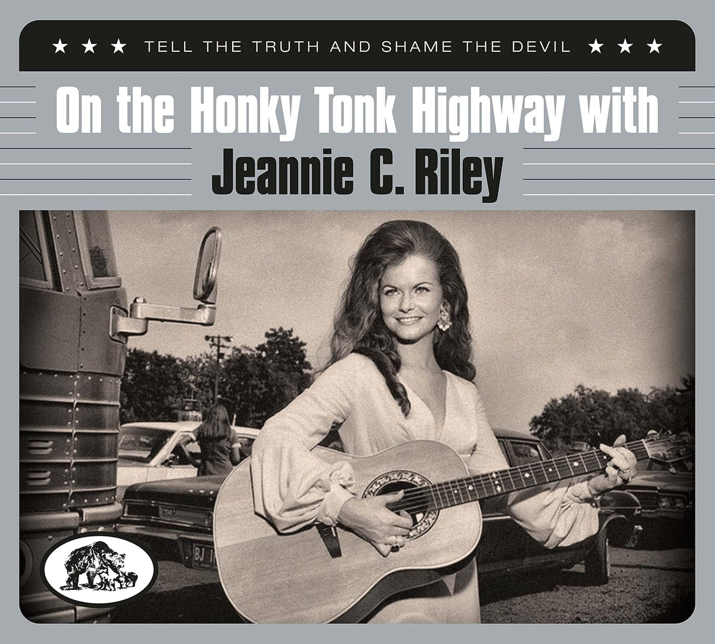 Black and white album cover of Jeannie C. Riley holding an acoustic guitar.