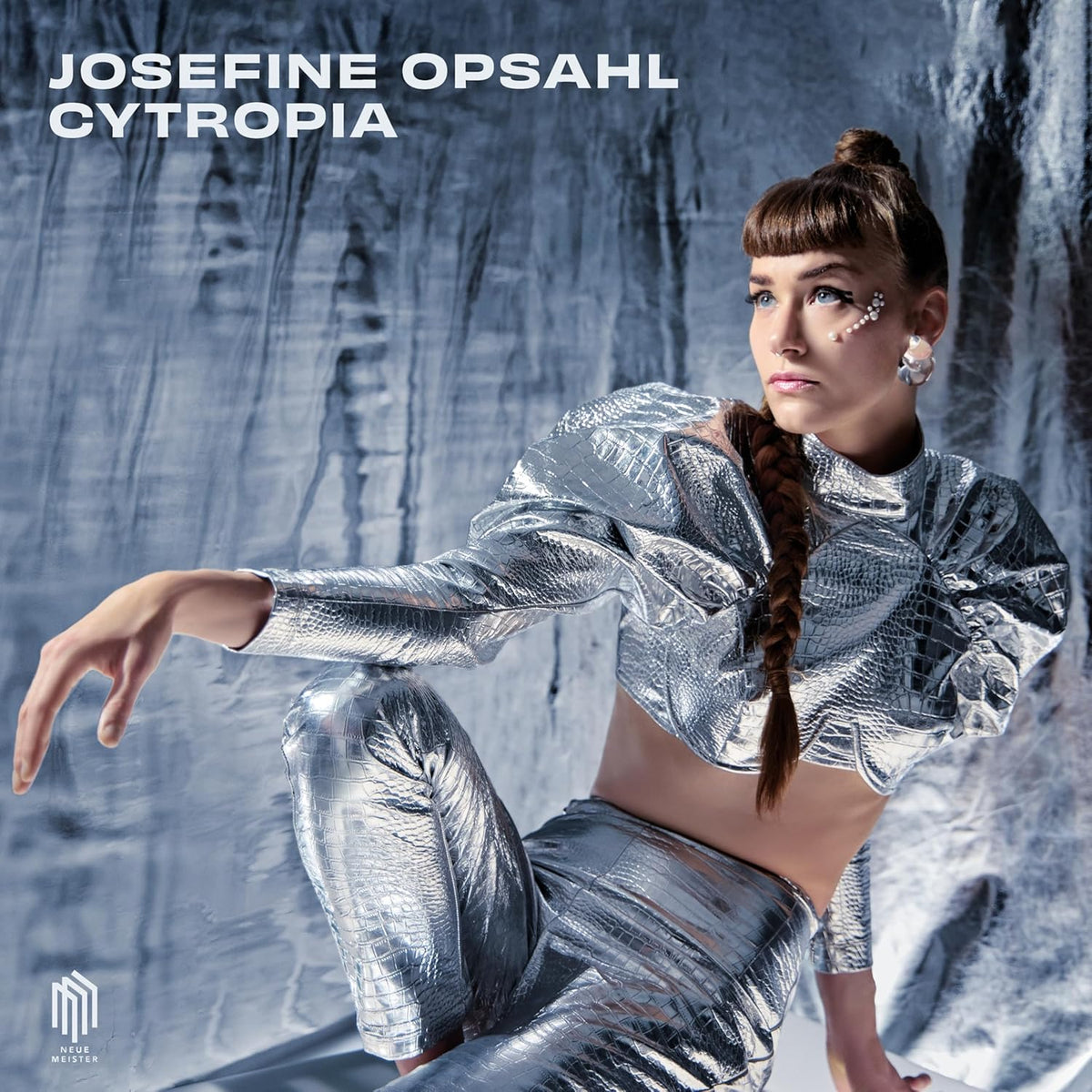 Album cover for Josefine Opsahl’s “Cytropia” featuring a woman in silver clothing.