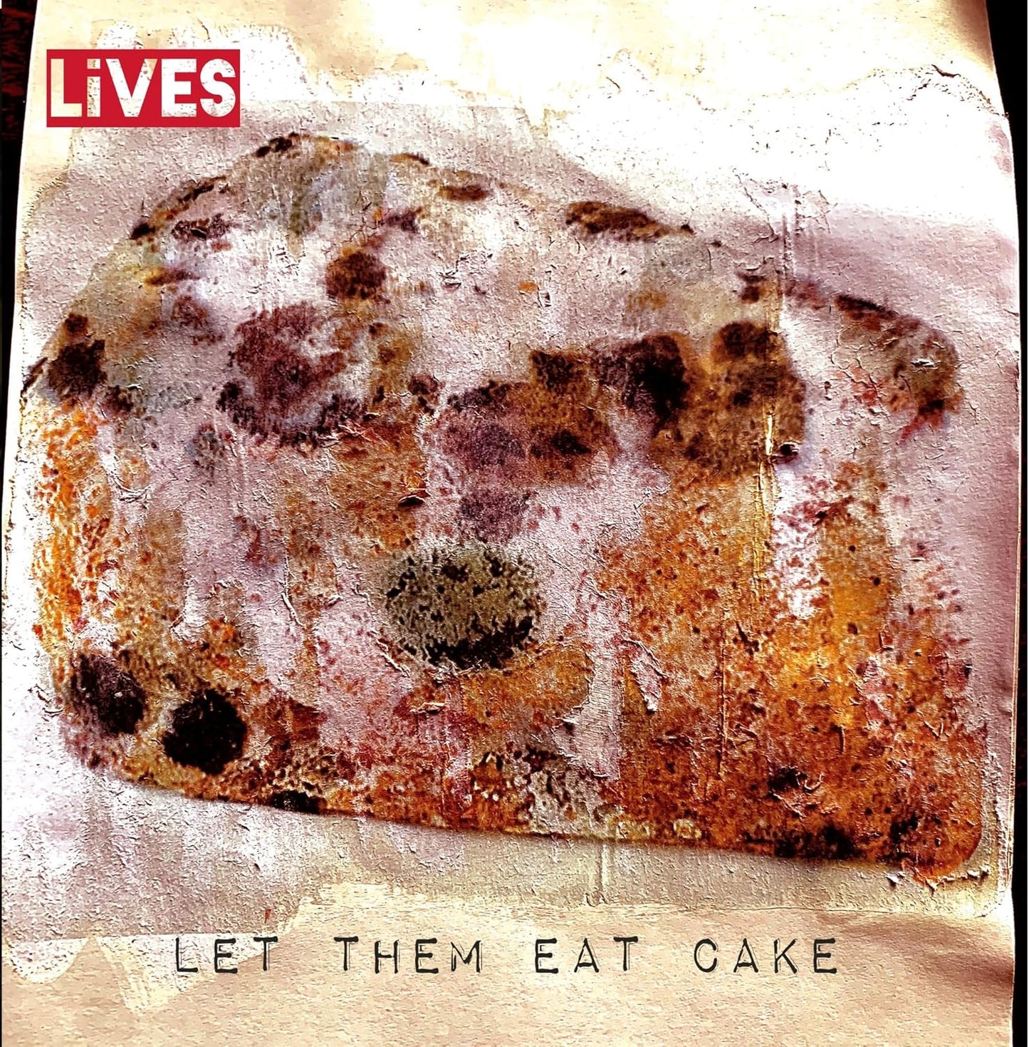 CD cover for "Lives - Let Them Eat Cake" featuring burnt cake.