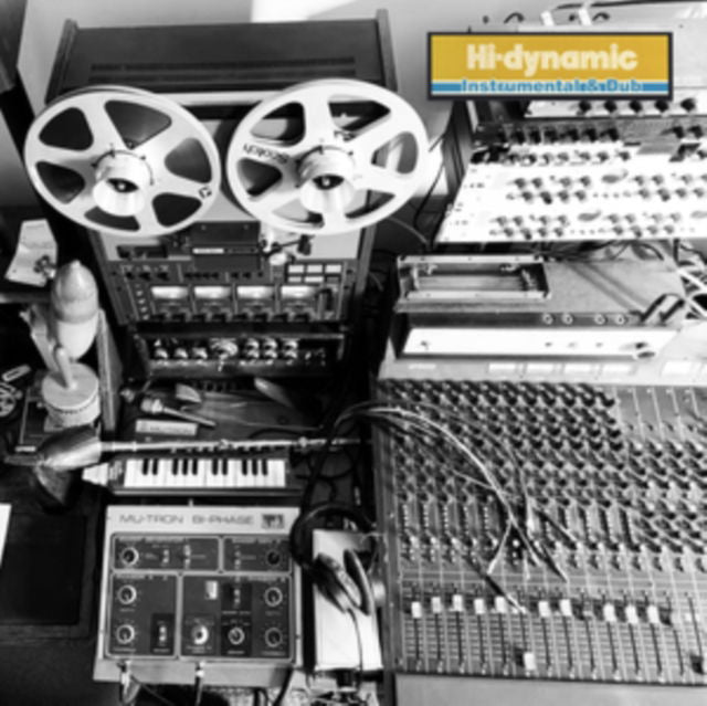 Black and white photo of vintage recording equipment and reels.