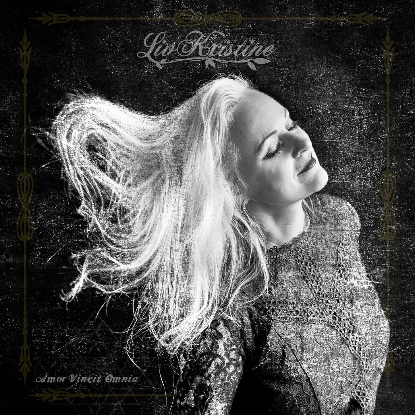Black and white album cover featuring Liv Kristine with flowing hair.