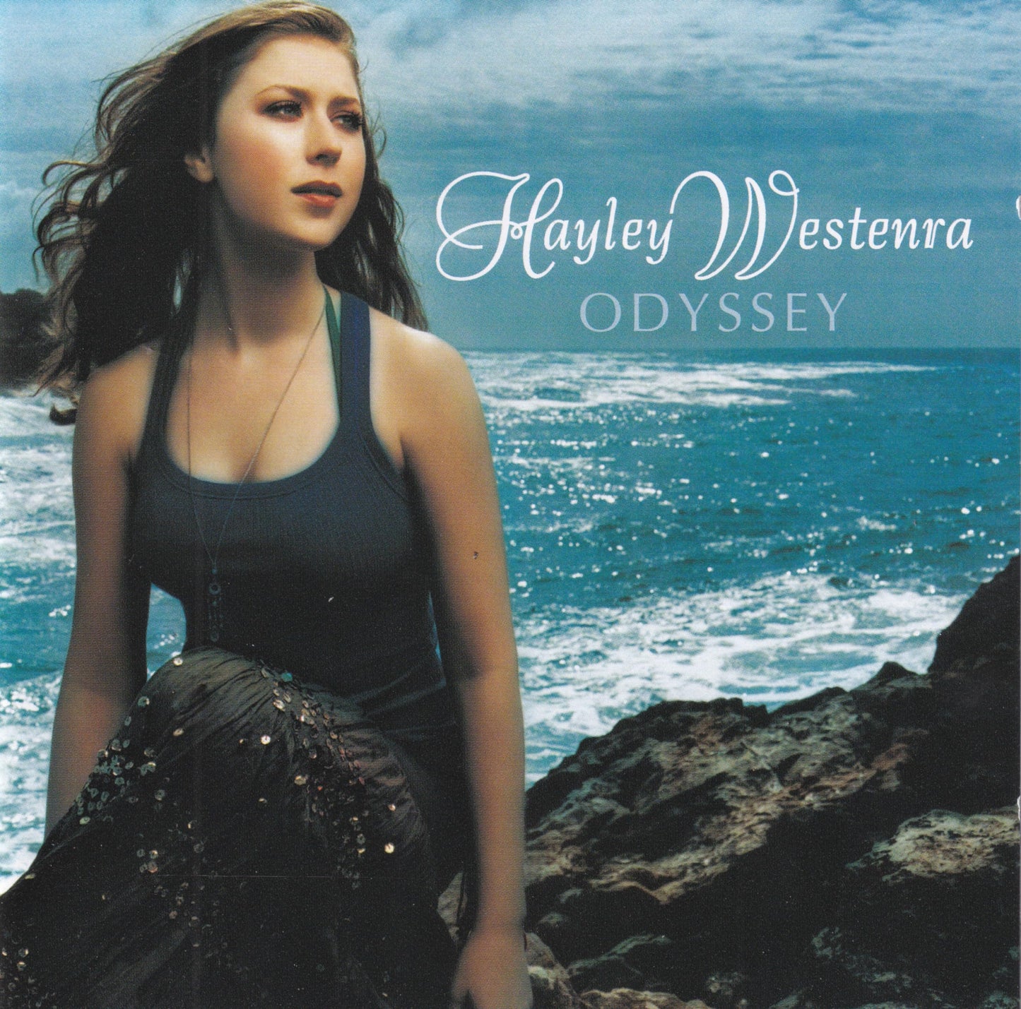 Hayley Westenra album cover, “Odyssey”, with ocean and rocky coastline.