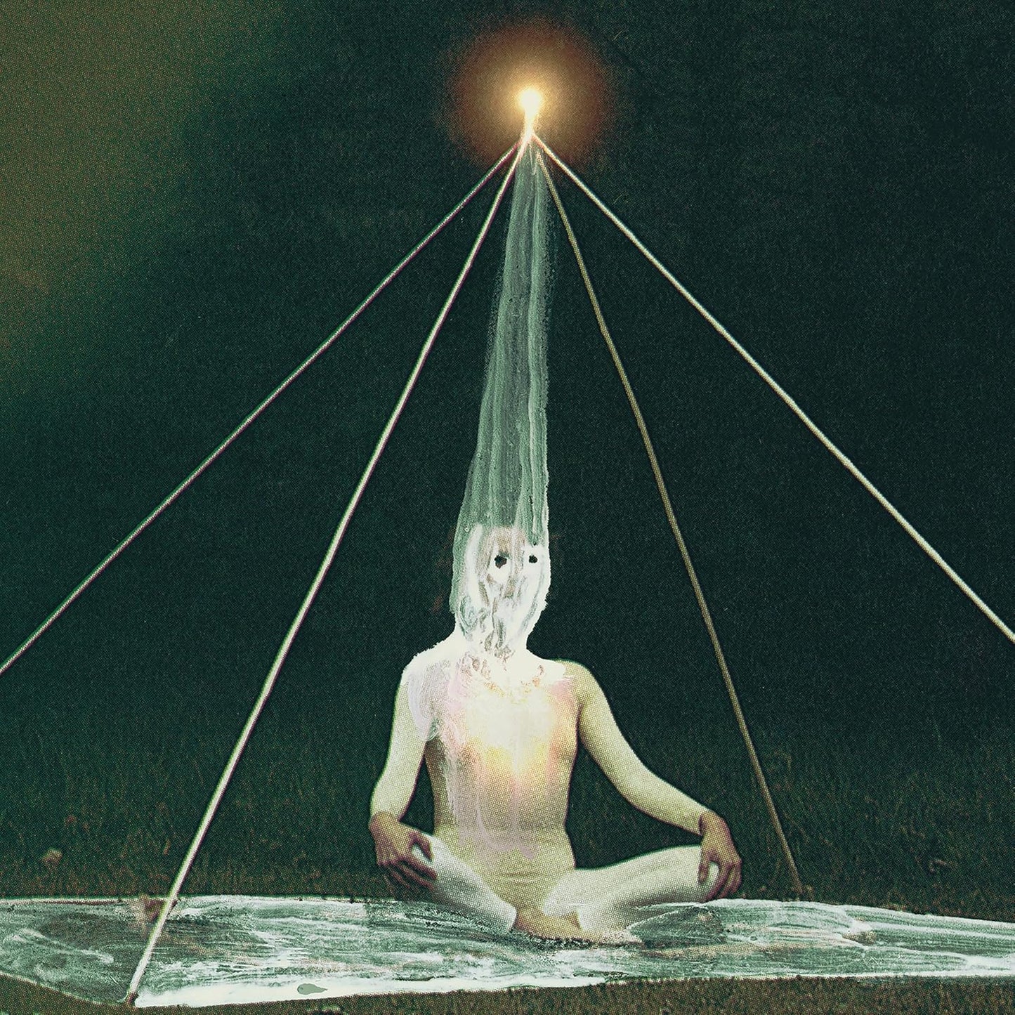 Figure in lotus position inside a pyramid, illuminated by a bright light.