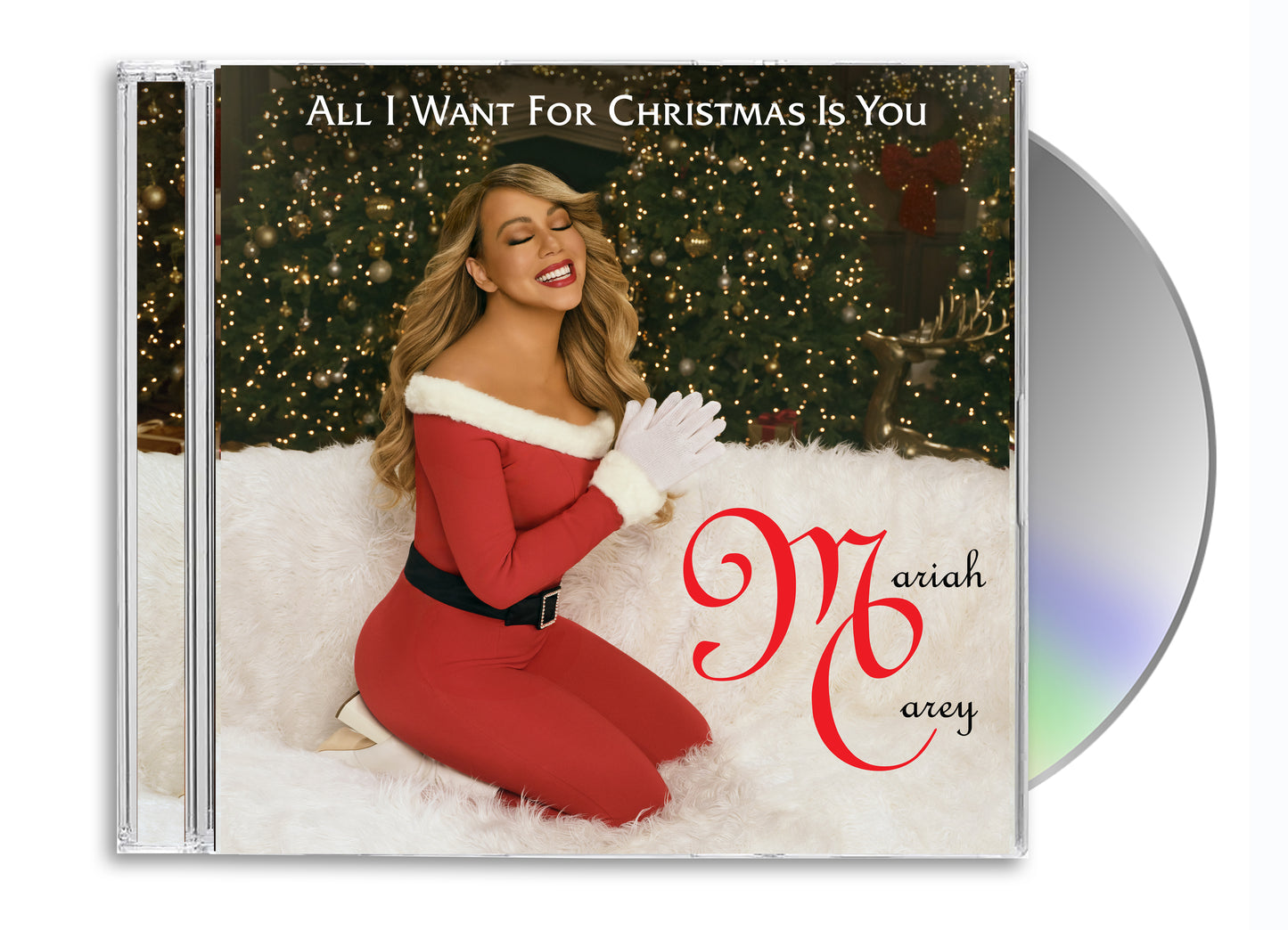 Mariah Carey in a red outfit kneeling by a decorated Christmas tree.