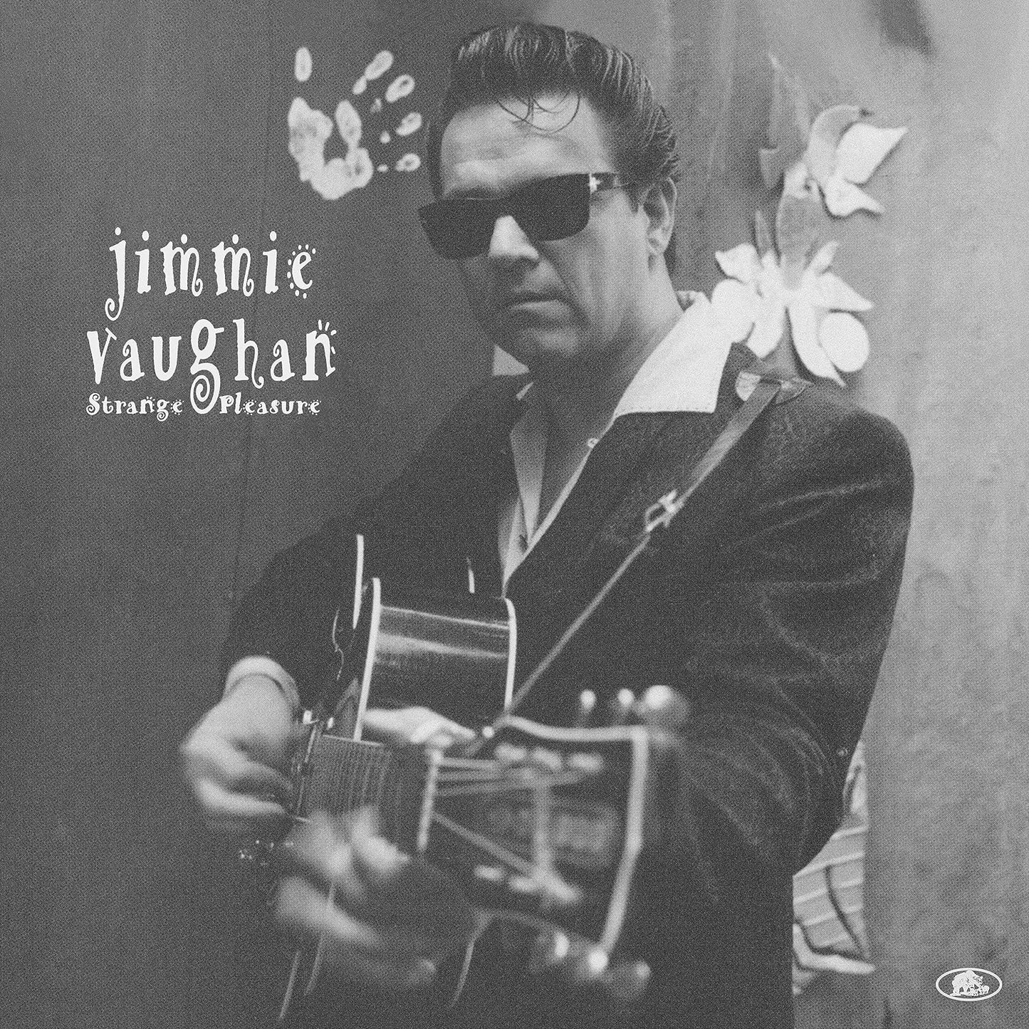 Black and white album cover featuring Jimmie Vaughan playing a guitar.