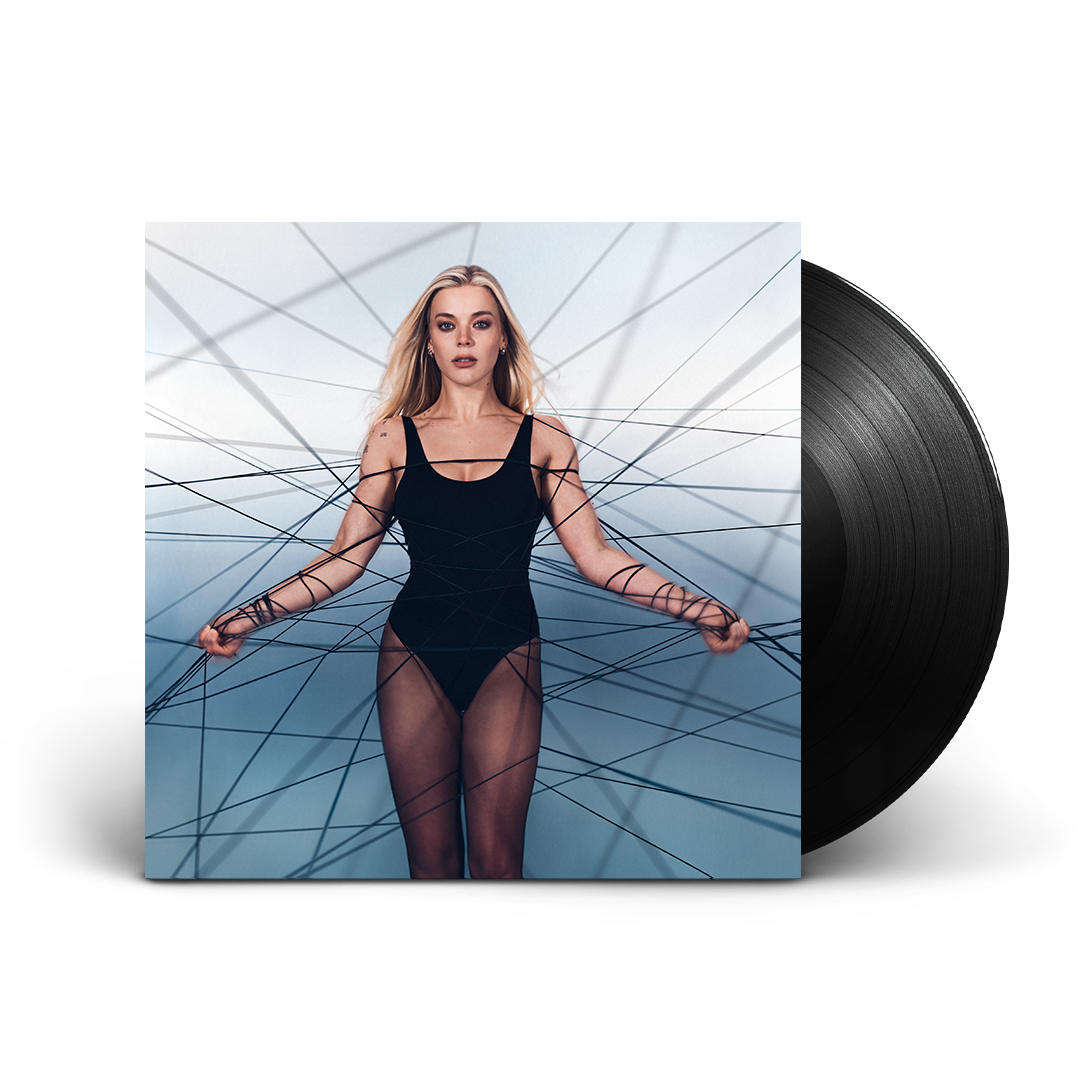 Becky Hill album cover "REBECCA" with black vinyl record beside it.