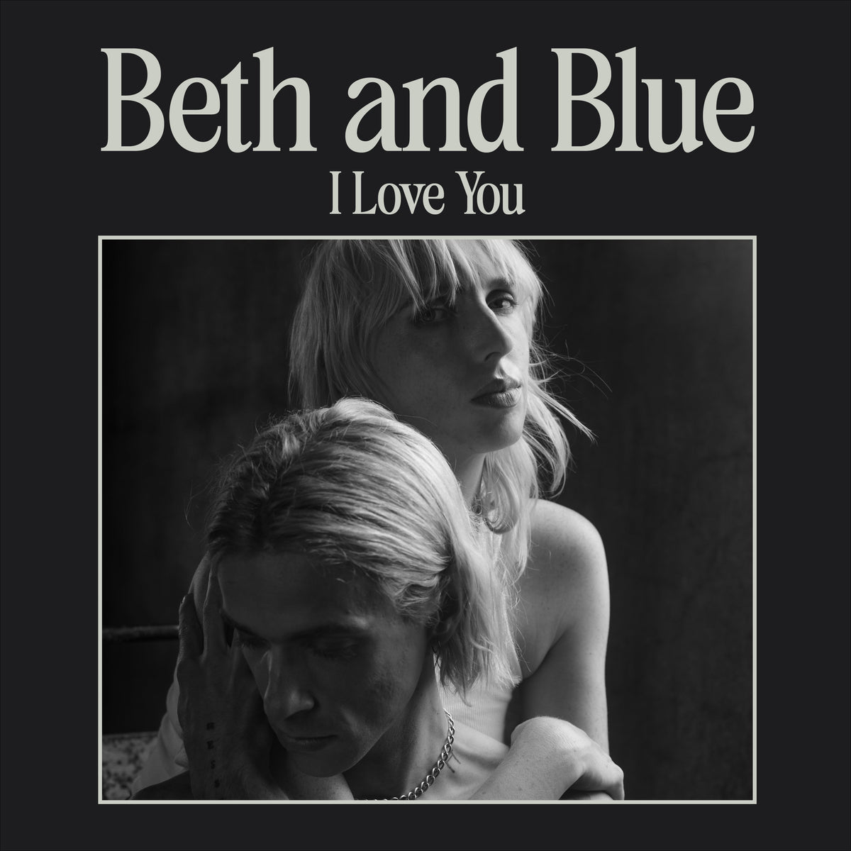 Black and white album cover featuring two people embracing closely.