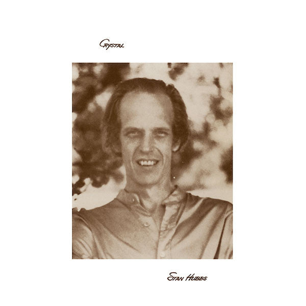 Sepia-toned portrait of a man with long hair, album cover art.
