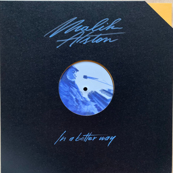 Black vinyl record with blue center label featuring a portrait.
