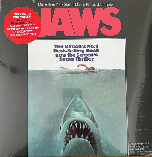 Jaws" soundtrack vinyl record cover featuring a shark rising from the water.
