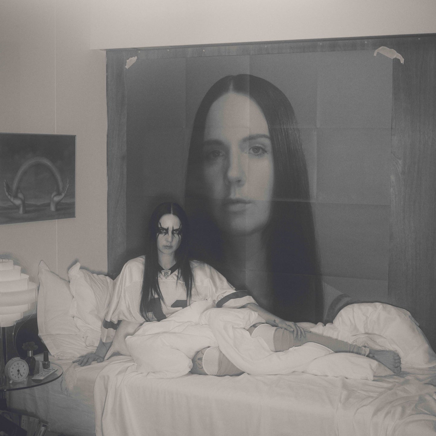 Black and white vinyl record cover featuring a woman’s blurred portrait.