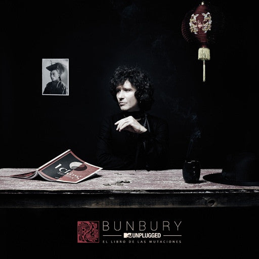 Bunbury Unplugged DVD cover: man at table with book and lantern.