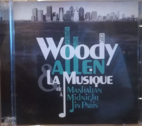 CD case with "Woody Allen - De Manhattan A" text and city skyline.