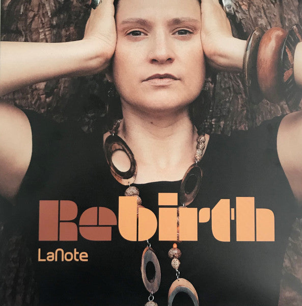 Lanote’s “Rebirth” vinyl album cover featuring a person with jewelry.