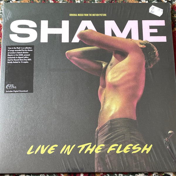 Shame - Live In The Flesh" vinyl record cover with a man’s torso.