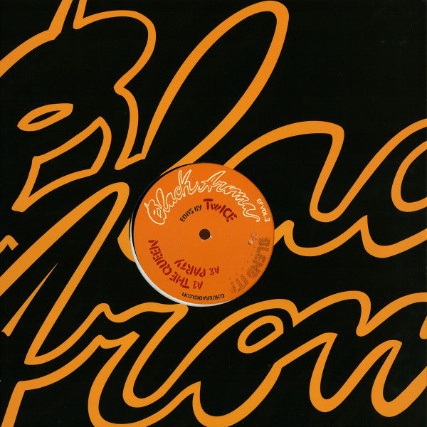 Black vinyl record with orange swirling design and text label.