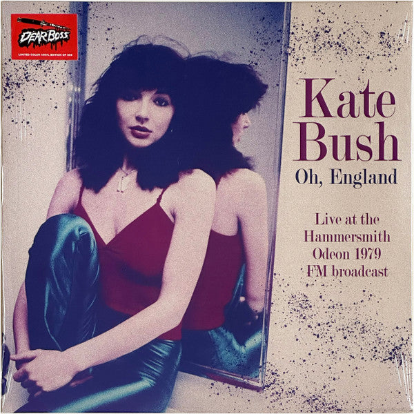 Vinyl record cover featuring Kate Bush in a red dress, side view.