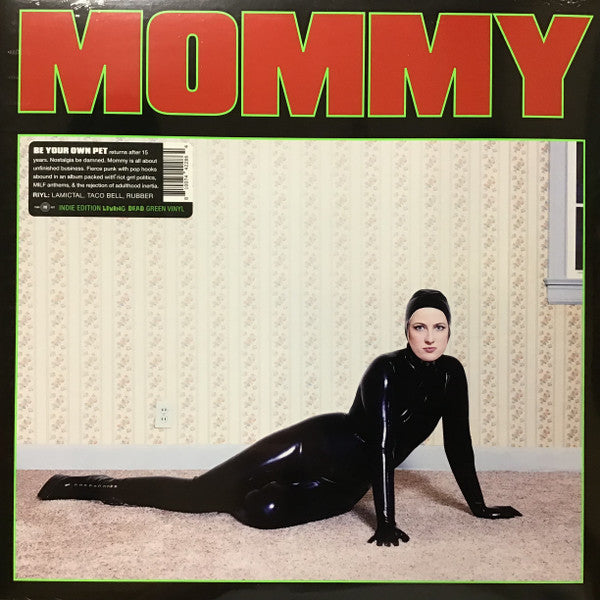 Green vinyl record cover featuring a woman in a black bodysuit.