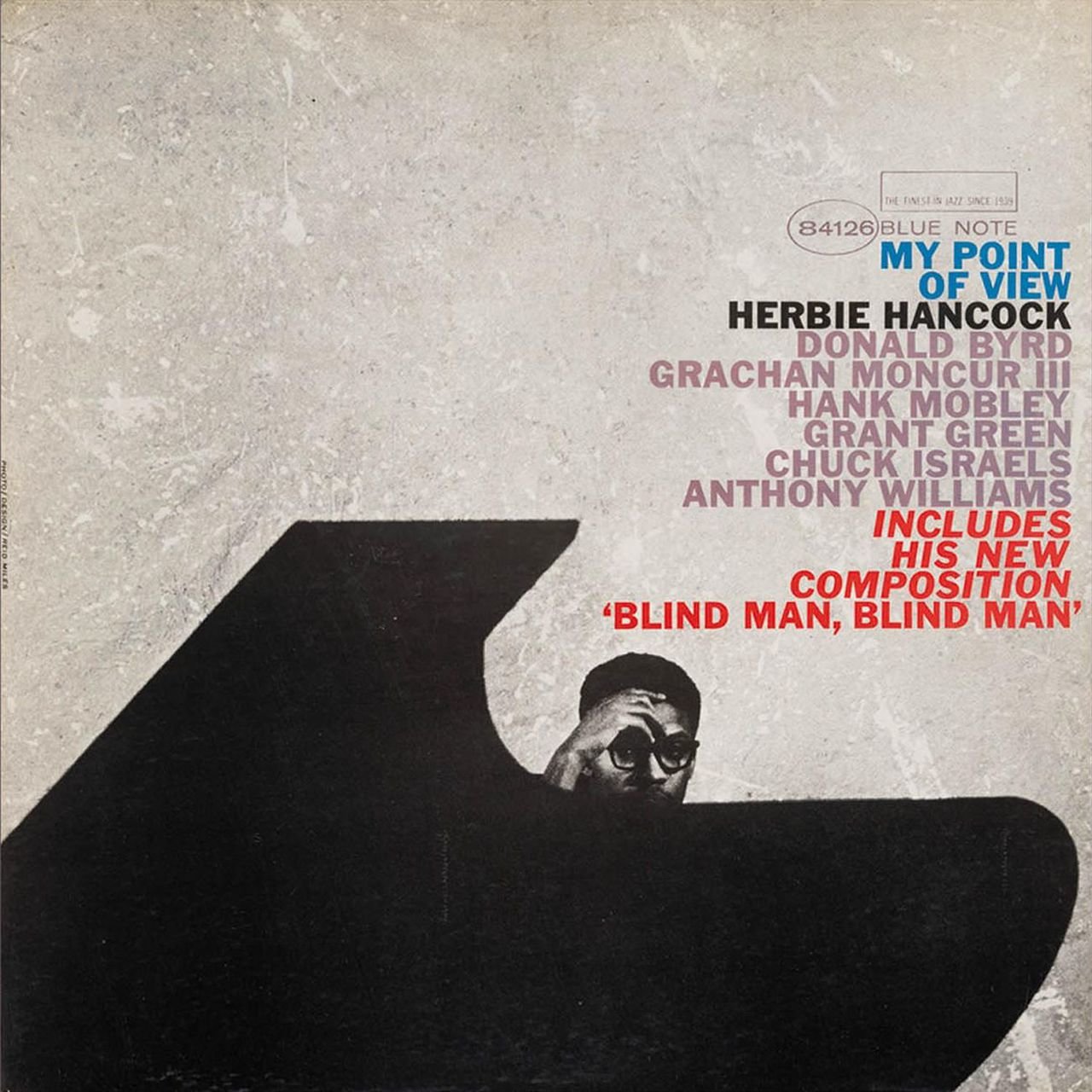 AlbumSHancock's album cover featuring a man's eyes peering over a black silhouette.