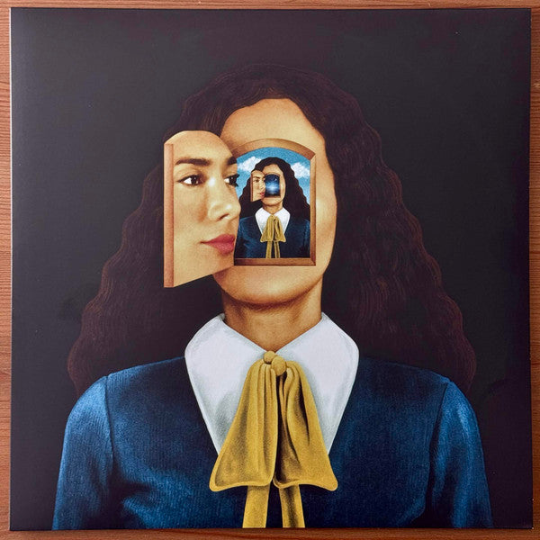Vinyl record cover featuring a woman with a cut-out revealing another portrait.