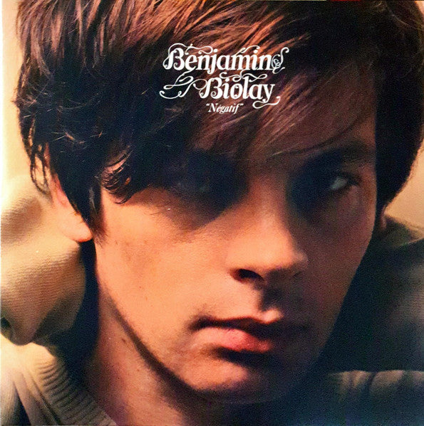 Vinyl album cover featuring a close-up portrait of a young man.