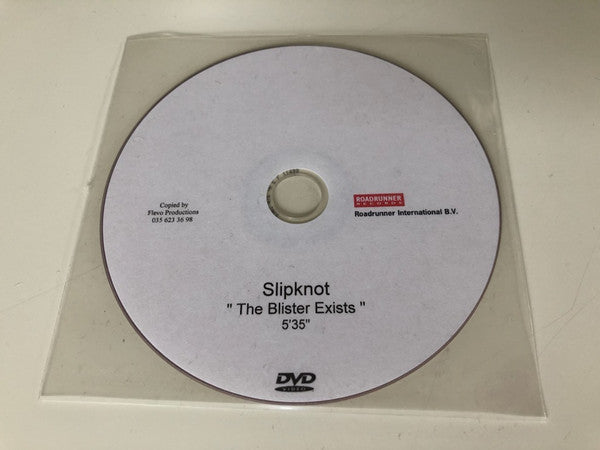 White DVD with "Slipknot: The Blister Exists" text and DVD logo.