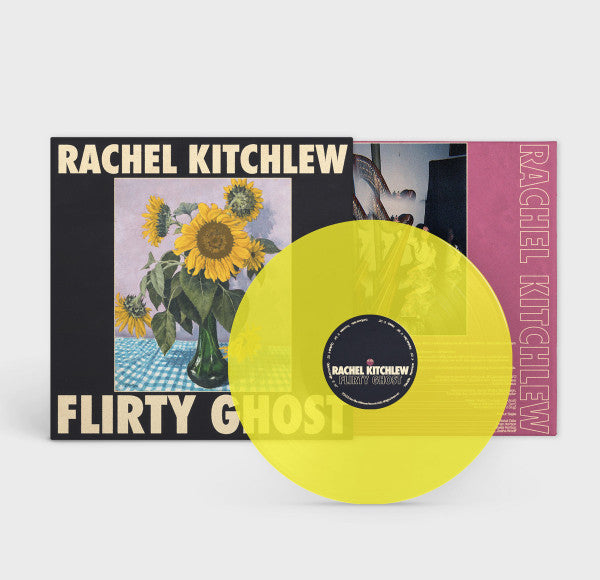 Yellow vinyl record in front of the Flirty Ghost album cover with sunflower artwork.
