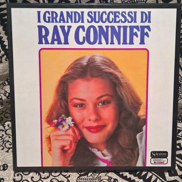 Record album cover featuring a portrait of a smiling woman with flowers.