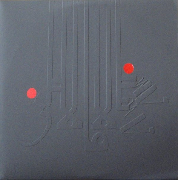 Black vinyl record cover with embossed text and red dots.