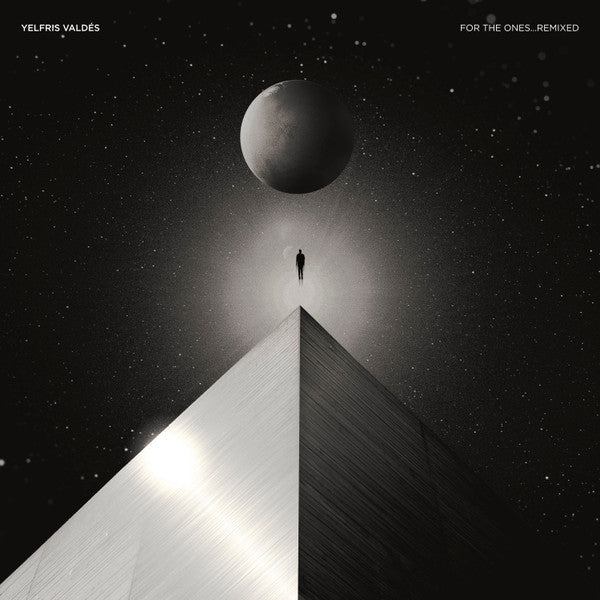 Black and white album cover with a lone figure and large planet.